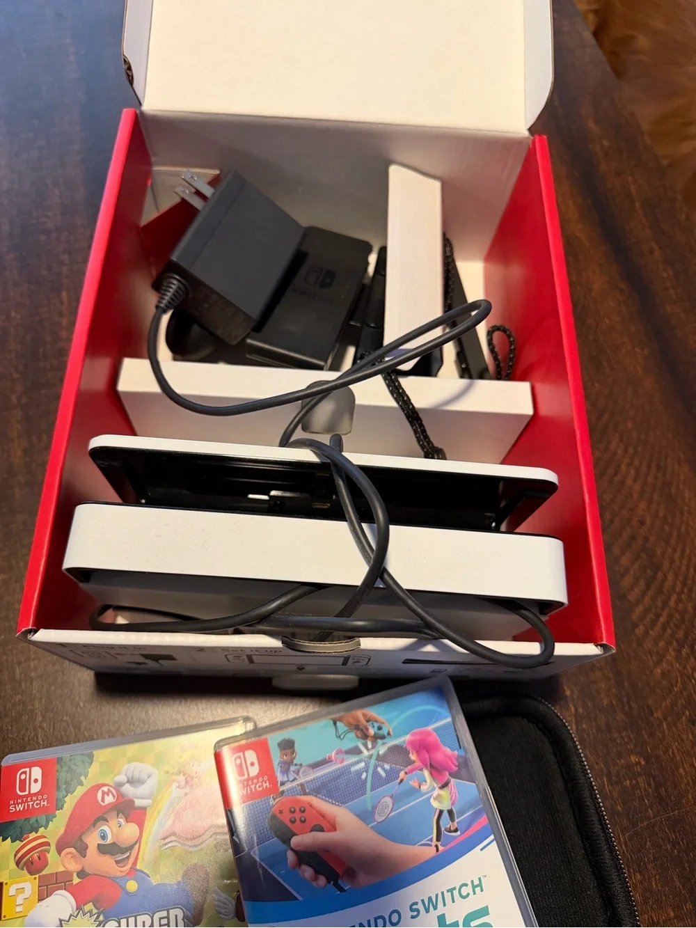 Nintendo Switch OLED Console Bundle in White with Black Case and Two Games